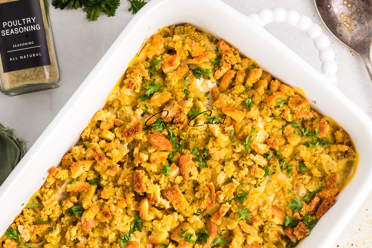 Church cookbook chicken casserole in a white baking dish topped with breadcrumbs and parsley