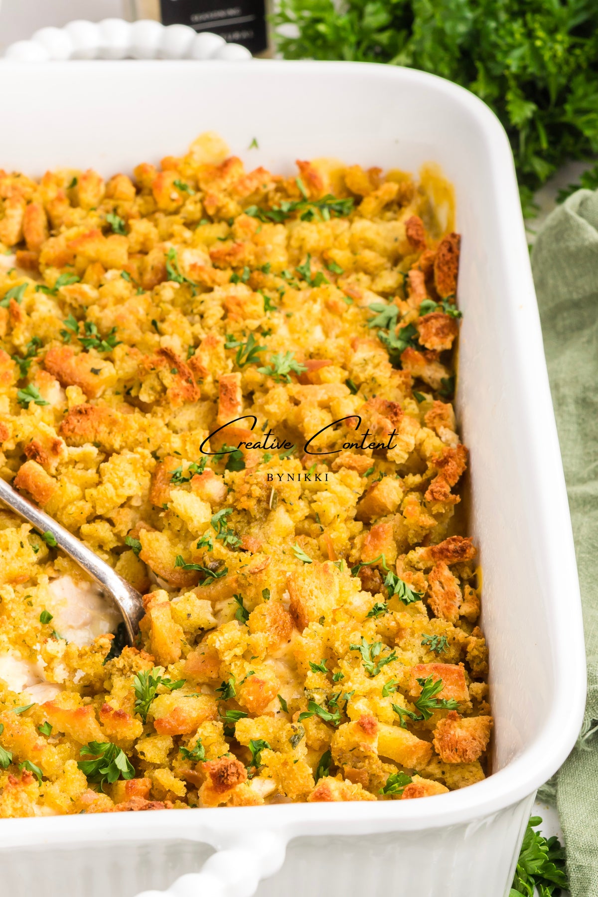 Church cookbook chicken casserole with a crispy breadcrumb topping in a white baking dish
