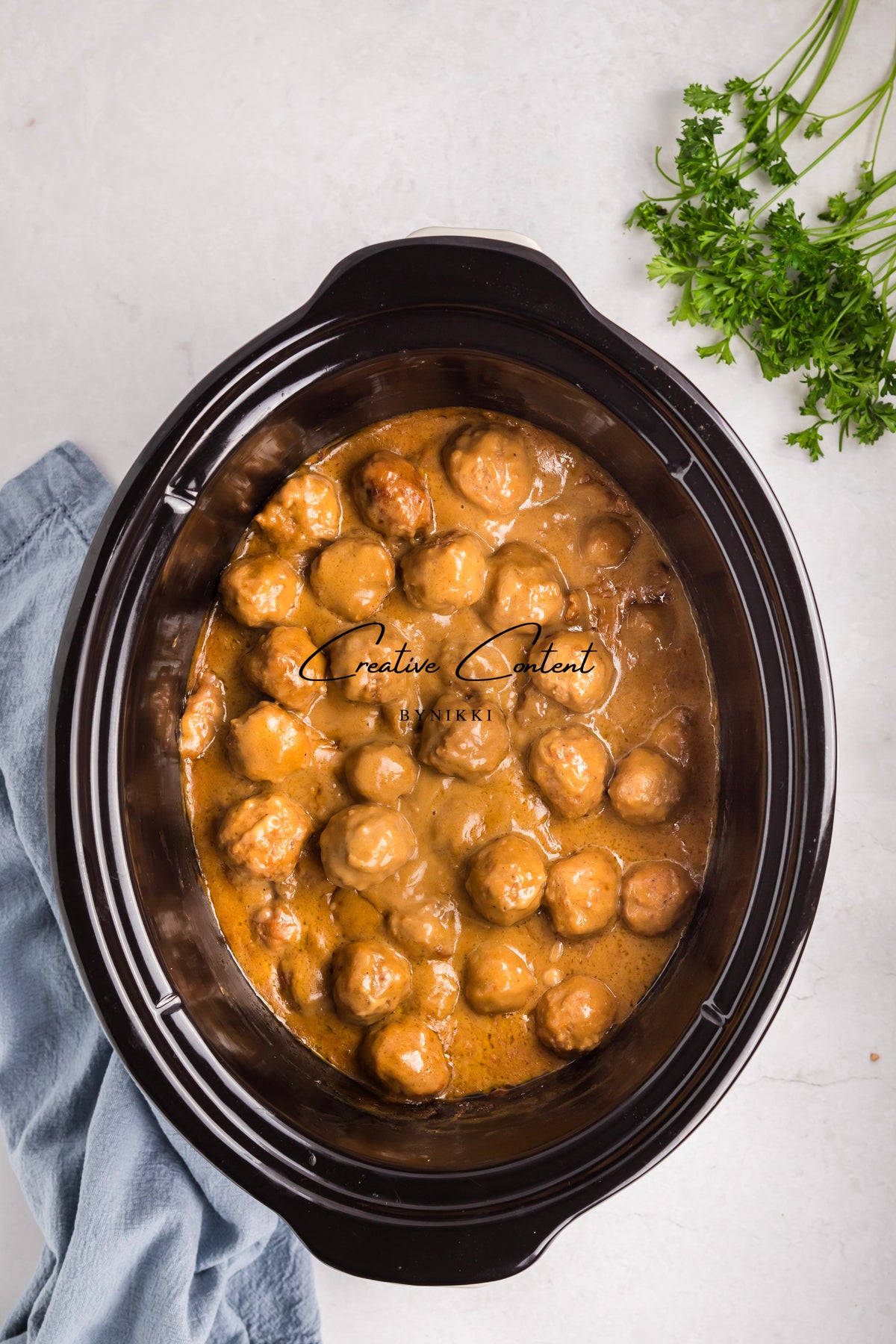 Crock Pot Smothered Meatballs and Green Beans - Exclusive: tender meatballs in a creamy brown sauce.