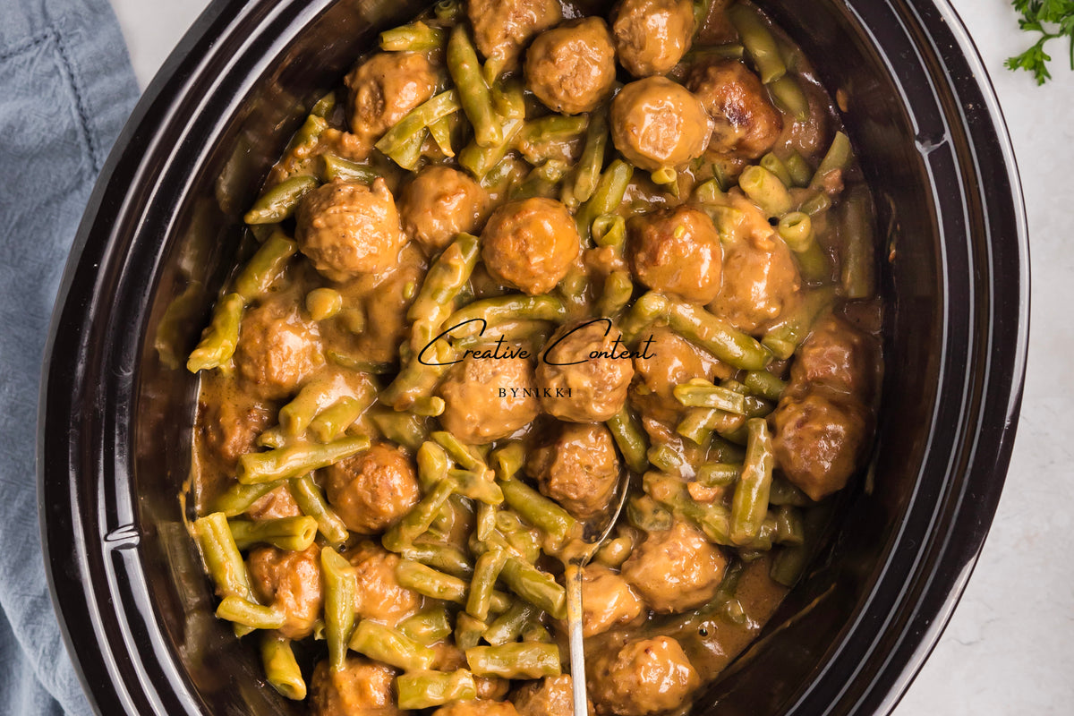 Crock Pot Smothered Meatballs and Green Beans - Exclusive featuring meatballs and green beans cooked in a brown gravy.