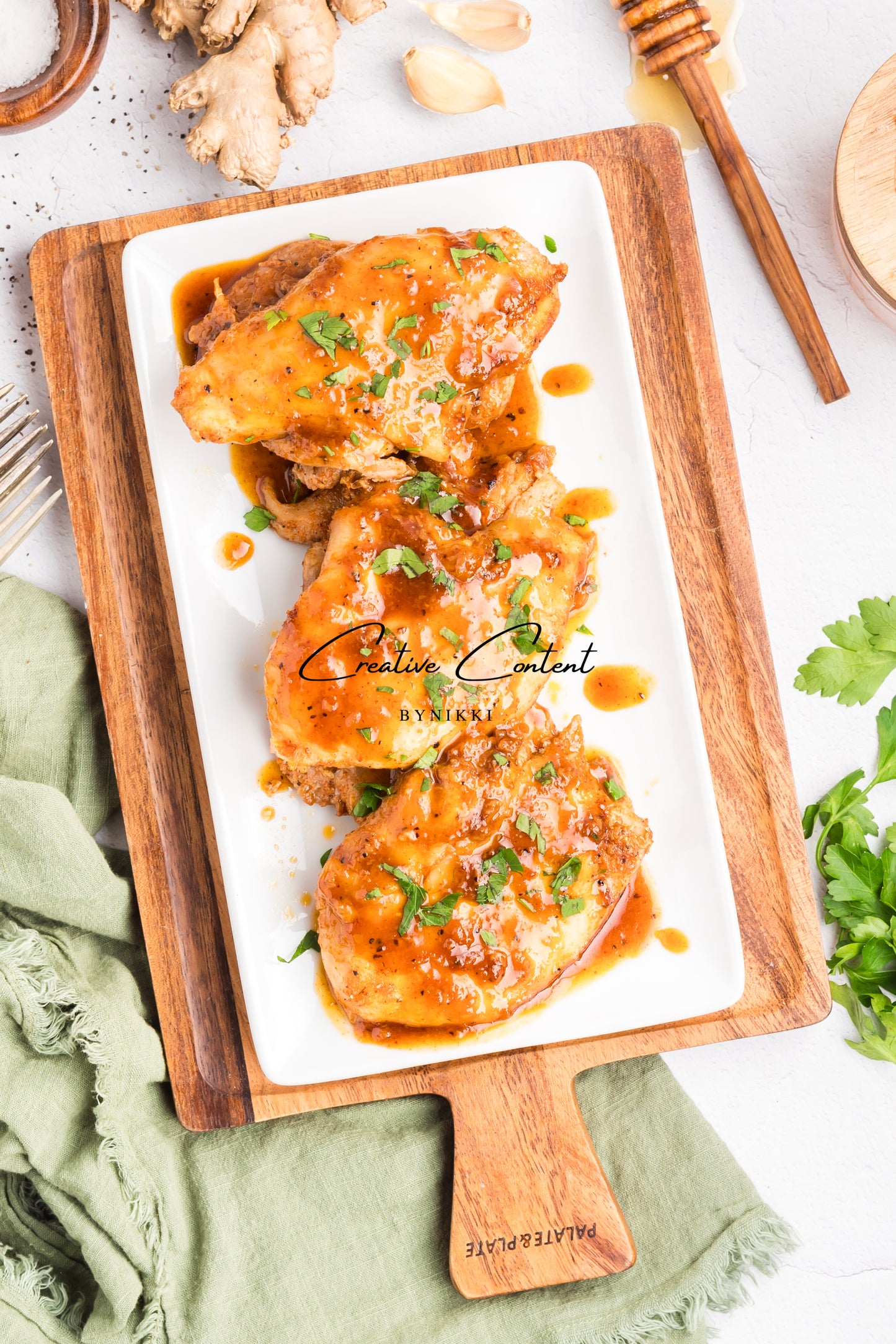 Honey garlic chicken on a platter. 