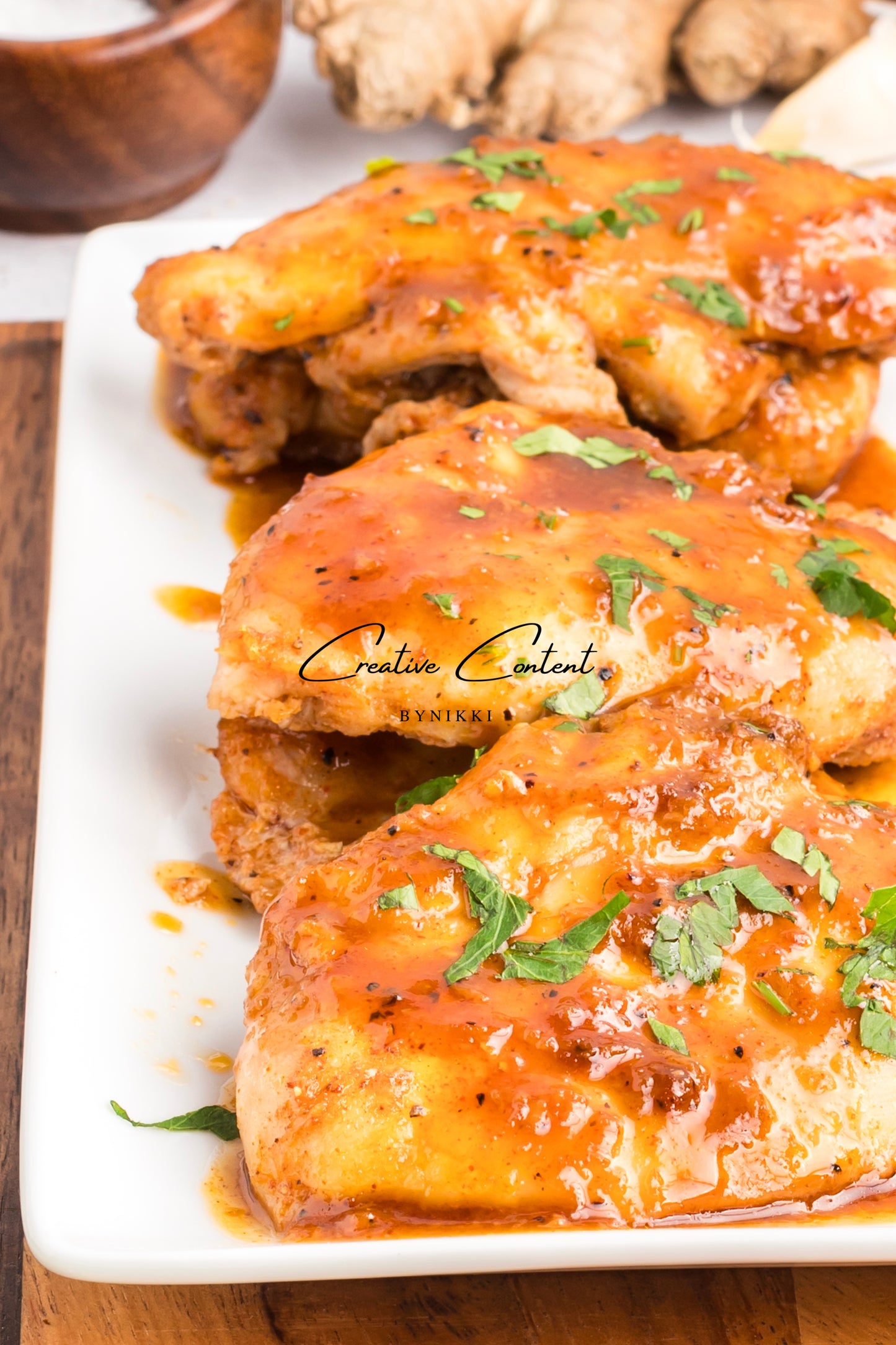 Honey garlic chicken on a platter. 