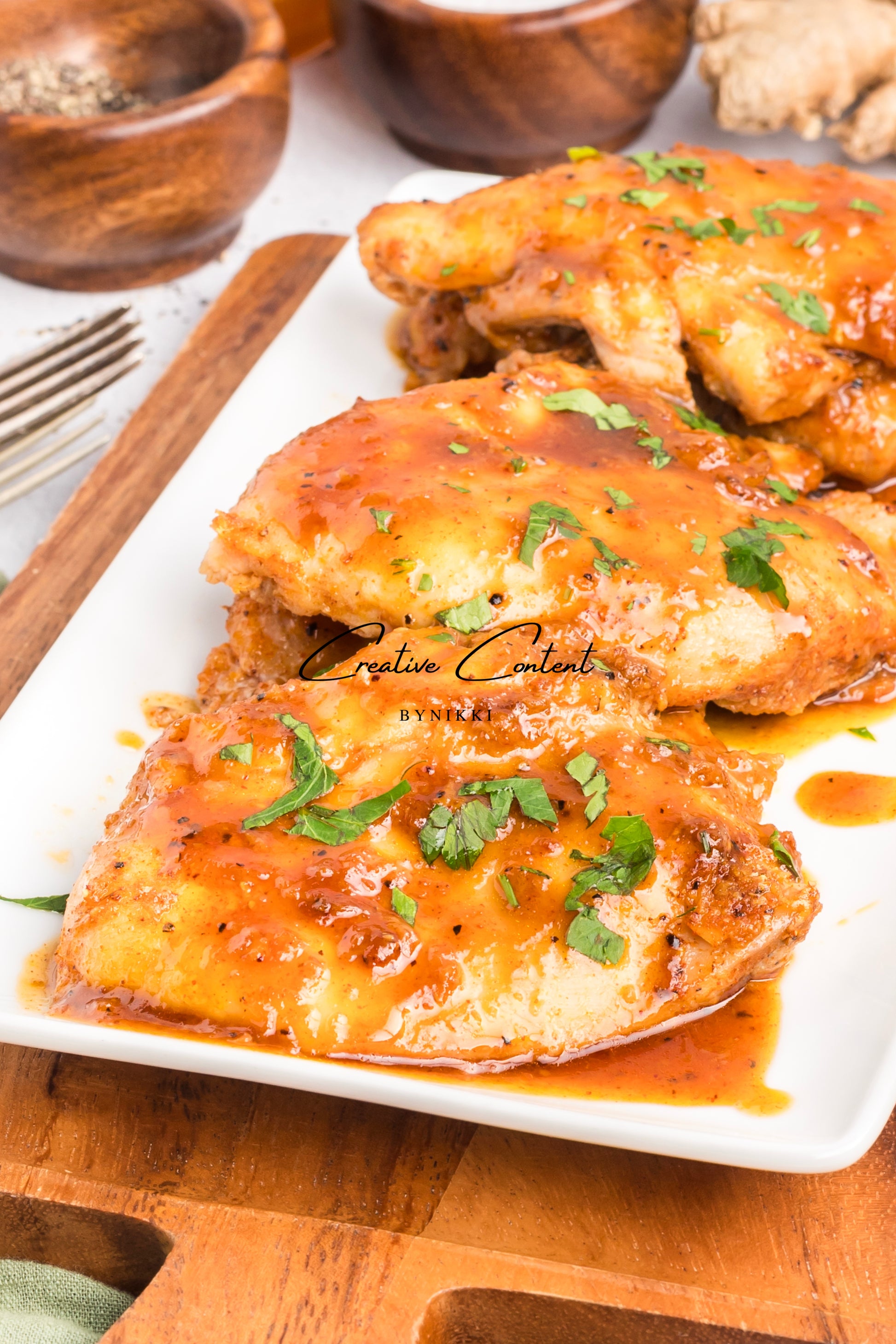 Honey garlic chicken on a platter. 