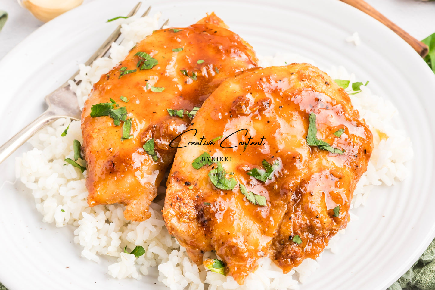 Honey garlic chicken on a platter. 