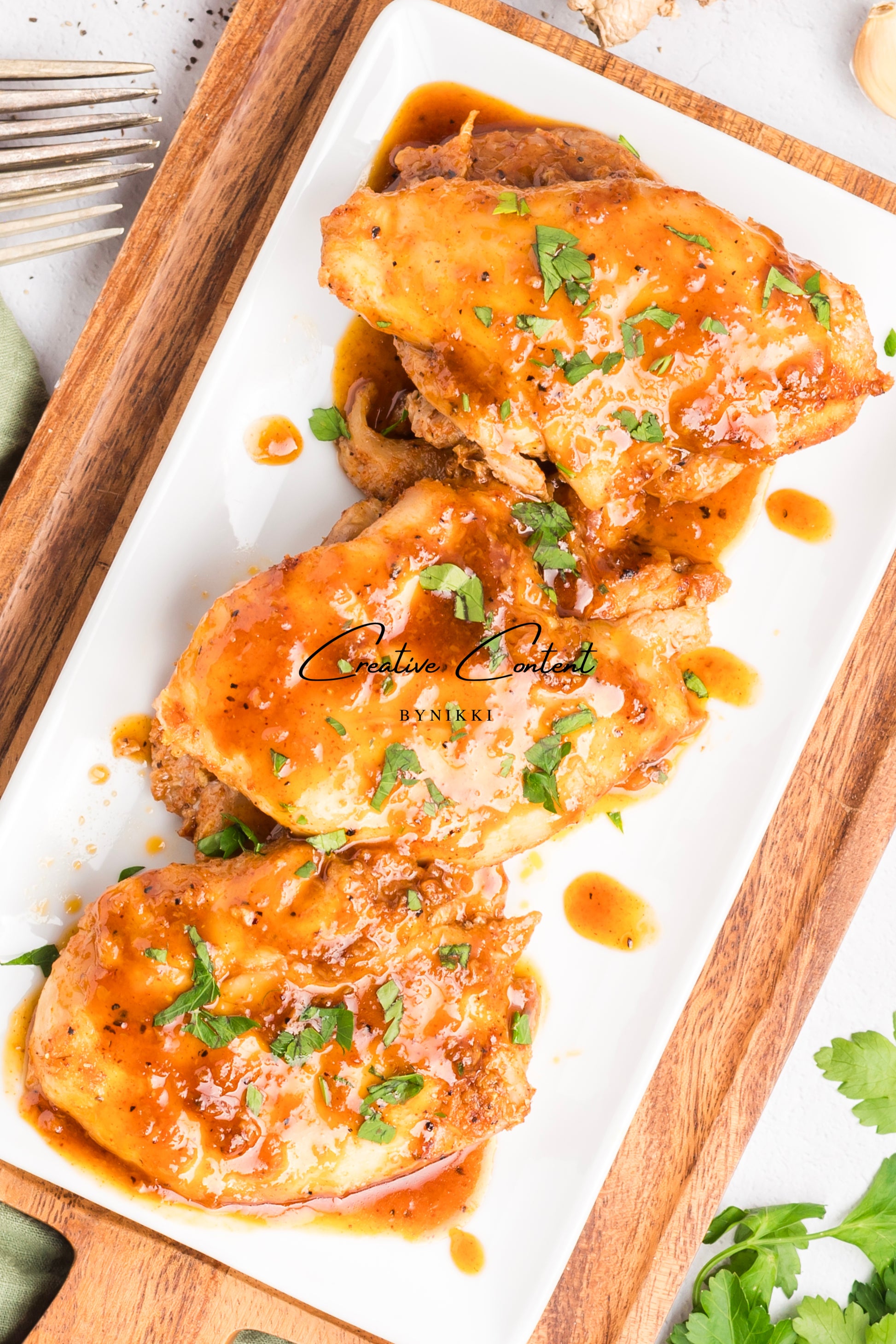 Honey garlic chicken on a platter. 