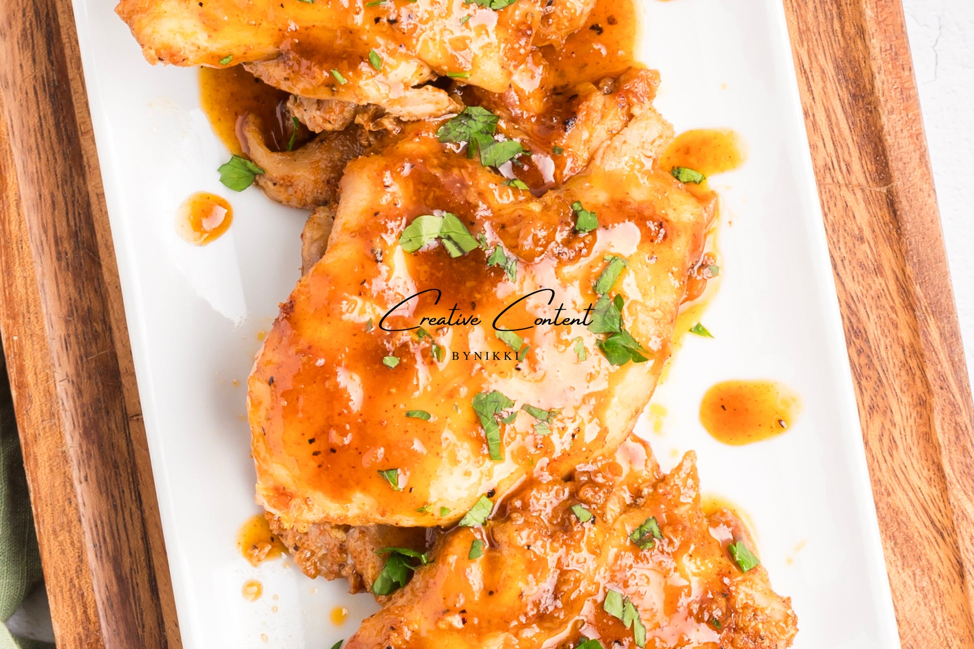 Honey garlic chicken on a platter. 