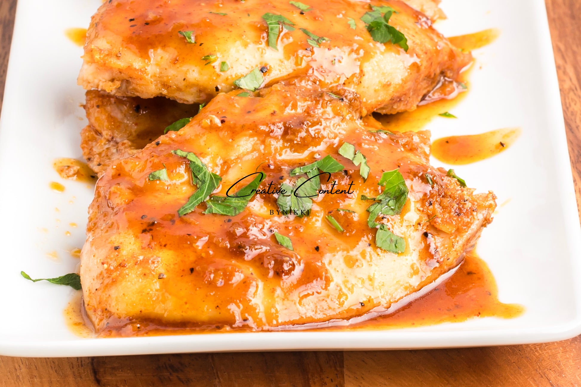Honey garlic chicken on a platter. 