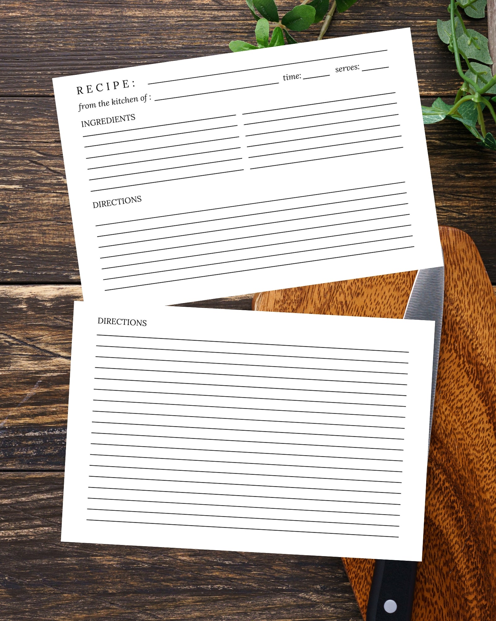 Two recipe cards on a wooden surface with a knife and greenery.