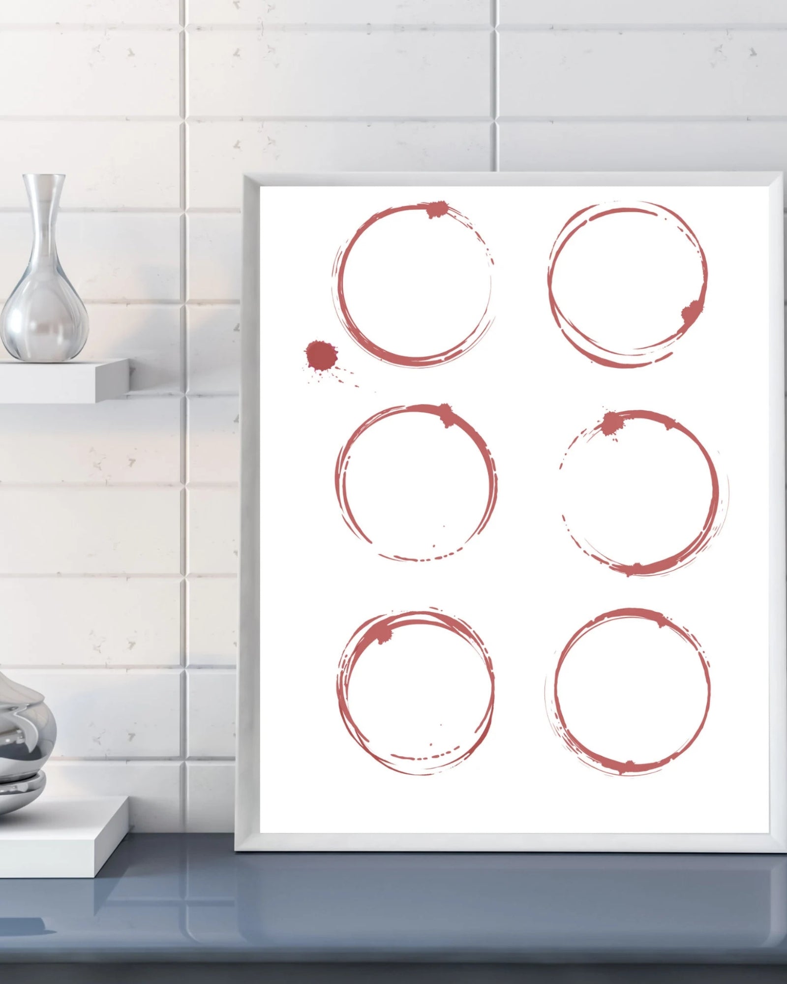 Framed artwork with red circular brush strokes on a white background, displayed in a modern interior setting.