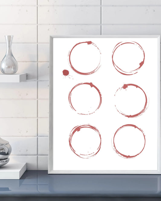 Framed artwork with red circular brush strokes on a white background, displayed in a modern interior setting.